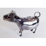 A silver continental cow creamer with glass eyes, continental marks to belly and import marks to