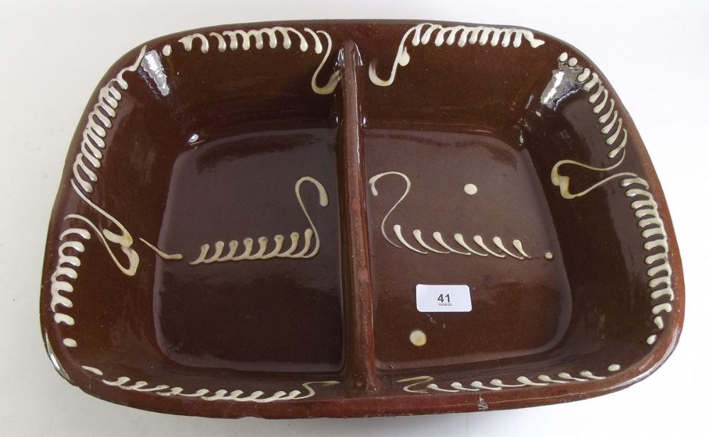 A large slipware oven dish - 40cm wide