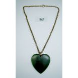 A 19th century jade heart pendant on 9 cart gold chain - chain 10g