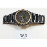 A Seiko Chronograph Quartz 7A38 - 7100 wrist watch in black and gold