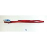 A large Colgate Plus advertising toothbrush - 37cm long