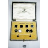 A set of 18 carat white gold and platinum cufflinks and studs set black onyx, cased