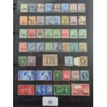 Clip file of British Postal Agencies and Forces overseas stamps, mint and used, defin and commem
