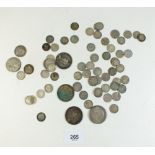 A quantity of silver content coinage including silver threepences (some pierced), florin and half