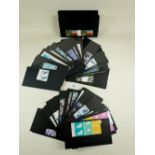 Box of GB QEII mint decimal defin/commem stamps in stock sleeves and packets from 1990s/2000s.