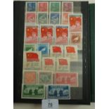 Green stamp stockbook of Chinese People's Republic mint stamps into the 1960s, mostly if not all