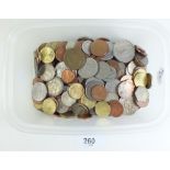 A quantity of world coinage with examples from Africa, Channel Islands, Belguim, France, Eire, Iran,