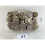 A collection of pre-decimal cupro-nickel coins including sixpences, shillings, two shillings and