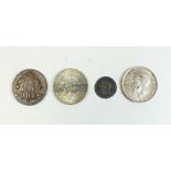 A group of four coins: George III threepence 1772, George V Florin 1919, George VI two shillings