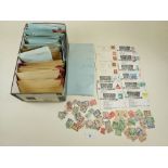 Shoe box full of packets of QV - QEII stamps, mostly if not all used defin, commem etc plus some