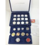 A presentation box containing mostly silver coins with examples from Channel Islands, Cayman