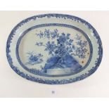 An 18th century Chinese blue and white large oval serving dish painted peonies on a rock, 36cm long
