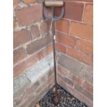 A 19th century cast iron garden dibber.