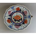 An early 19th century Mason's Ironstone warming plate decorated water lily