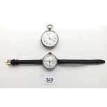 A white metal continental fob watch and an early 20th century silver wrist watch - possibly a WWI