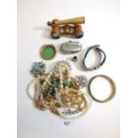 A box of costume jewellery and pair of opera glasses