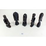 Five various small carved African hardwood figures, the largest 13cm tall