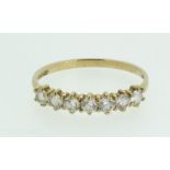 A 9 carat gold ring set seven diamonds - size N 1/2