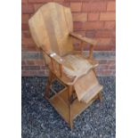 A vintage high chair converting to table and chair