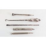 A silver button hook and two silver pencils etc