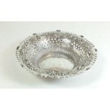 A silver trinket dish with embossed and pierced decoration, Birmingham 1899 72g, 14cm diameter