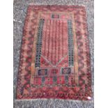 A Persian prayer rug with arch design on madder ground 140 x 92cm