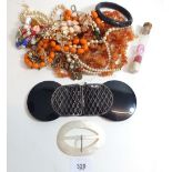 A small box of costume jewellery to include necklaces and bracelets