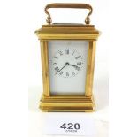 An early 20th century gilt brass miniature carriage clock, with key, 7cm