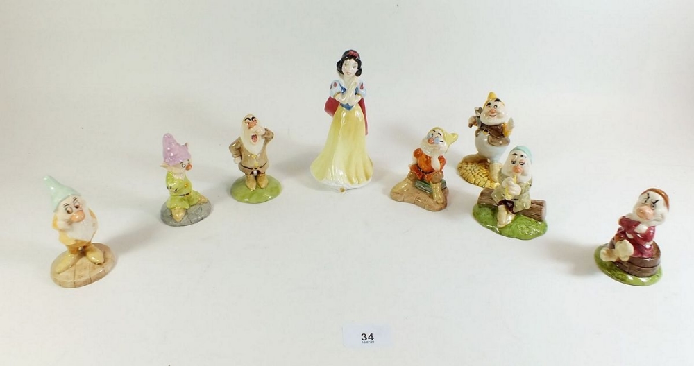 A Royal Doulton Disney Snow White and the Seven Dwarves set (Happy A/F).