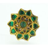 An Indian gold cluster flower form ring set green stones with decorative floral enamel back and