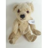 A small blonde Farnell teddy bear with glass eyes, stitched nose and mouth & nose, 26cm
