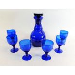 A Bristol blue glass decanter and six glasses