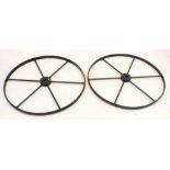 A pair of antique large wrought iron shepherd's hut wheels, 86.5cm diameter