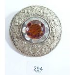 A large silver plated Scottish Clan brooch set orange stone, 9cm diameter