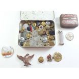 A box of military collectable's including badges and buttons