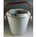 An Edwardian pottery toiletry pail with floral printed decoration to rim