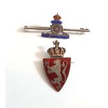 A silver and enamel military sweetheart badge and a silver and enamel shield form badge with lion