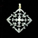 A silver and gold set diamond pendant of openwork design set with a pearl to centre -