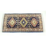 A Turkoman style rug with triple lozenge design - 205 x 96cm