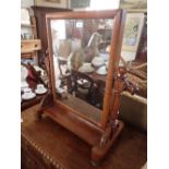 A 19th century mahogany toiletry mirror with turned supports - 70cm tall