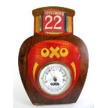 An early 20th century Oxo Advertising wooden printed barometer with calendar 31cm tall and other