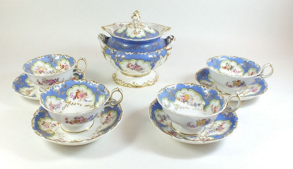 A set of four 19th Century porcelain cabinet cups and saucers decorated with floral sprigs