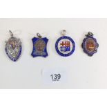 Four silver and enamel fobs including a 'Justice & Gentleness' Ruskin School Home fob, Birmingham