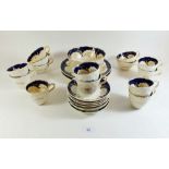 A Victorian tea service with blue and gilt decoration and moulded basketware exterior borders
