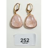 A pair of 18 carat gold rose quartz drop earrings set diamonds