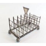 A Victorian silver plated Eton House Sports 'Hurdles' toast rack engraved to G L Hoare, 1897