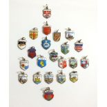 A box of 800 standard continental silver and enamel souvenir charms