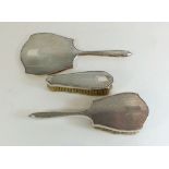 A silver backed three piece brush and mirror set, Birmingham 1936