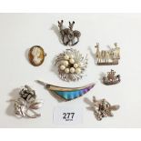 A good selection of silver and white metal brooches