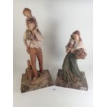 Two Monteserrat Ribes figures of a man and woman with children, 43 x 32cm tall